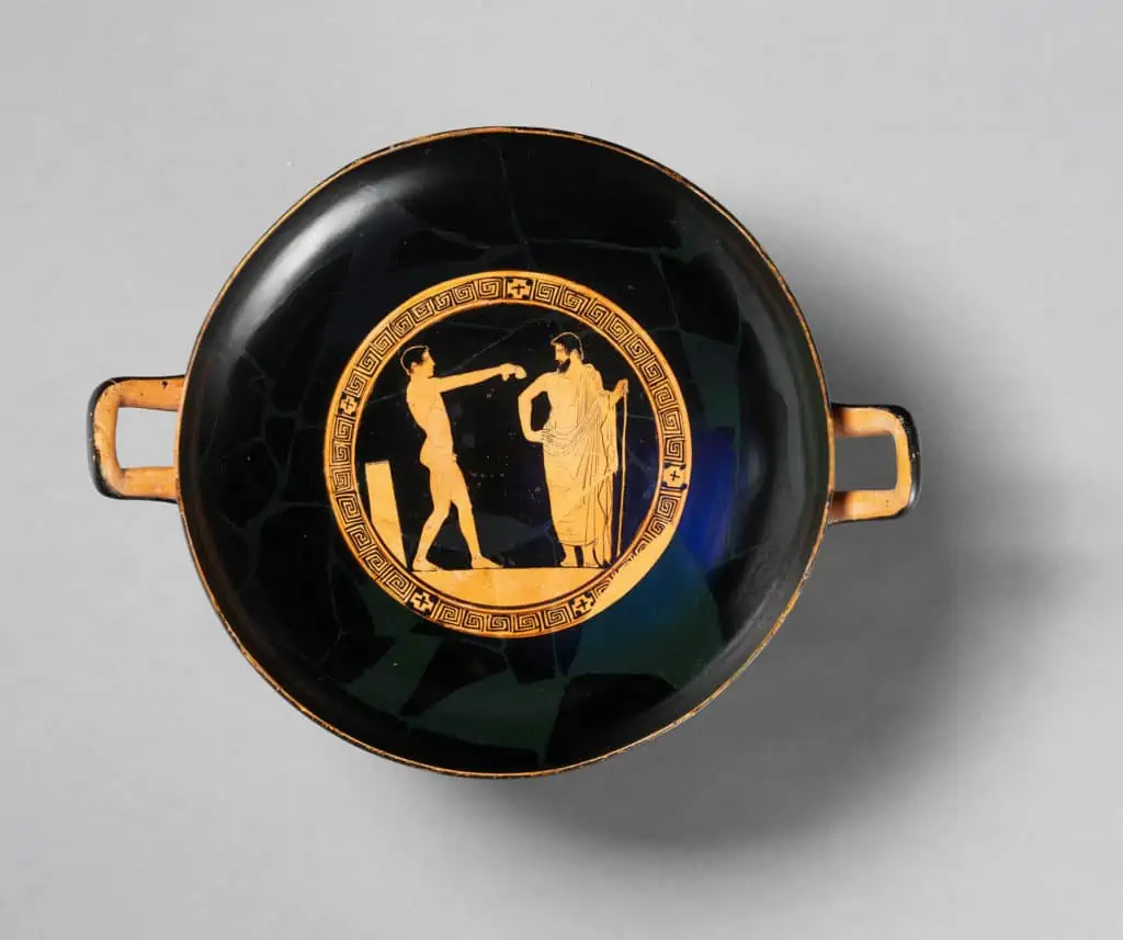Trinkgeschirr (kylix) um 460 v. Chr. Ein Mentor überwacht das Training eines jungen Athleten im Gymnsium.